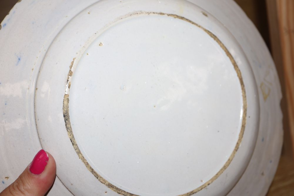 A collection of five 18th century Delft dishes, largest diameter 23cm